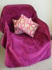 Magenta Chenille Throw over a Cane Chair